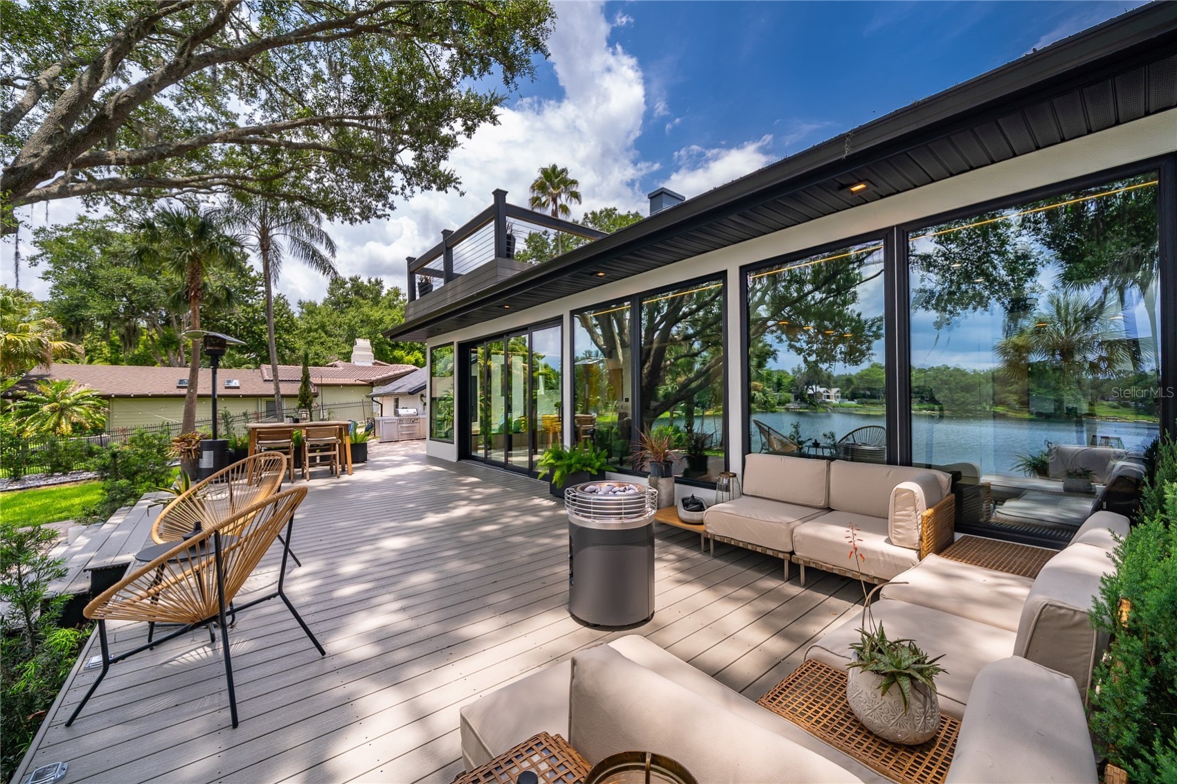 A twelve-foot sliding glass wall opens the living area to the terraces